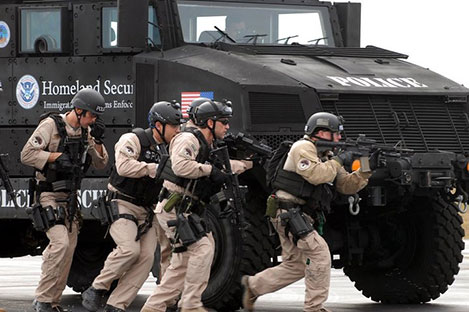 Photo of ICE Police with Armored Truck