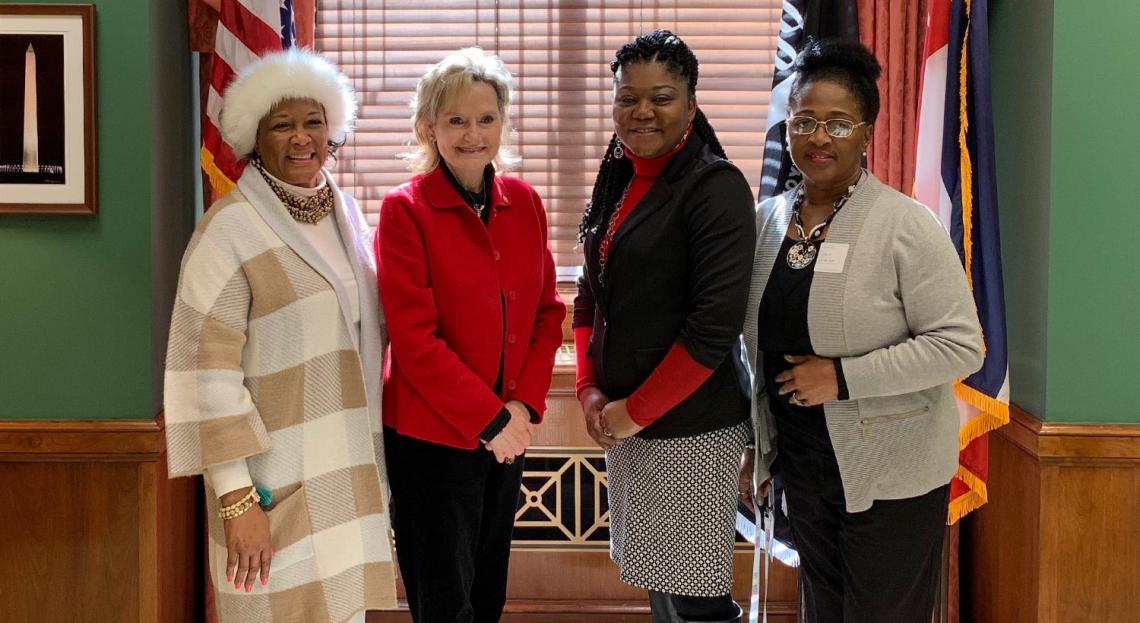Senator Hyde-Smith visits with DeSoto County Head Start representatives Eloise McClinton, Angela Mayfield, and Lillie Smith