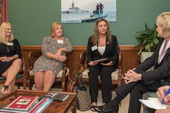 Senator Hyde-Smith visits with Jessica Fly of Grenada and representatives of the National Hardwood Lumber Association
